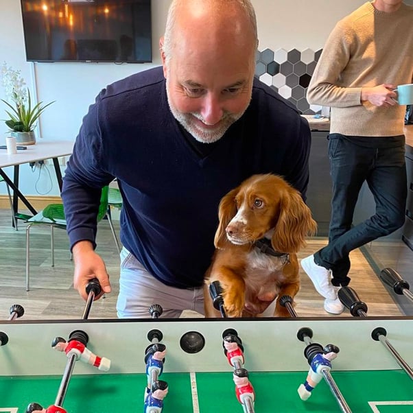 Table football played by Sean and dog