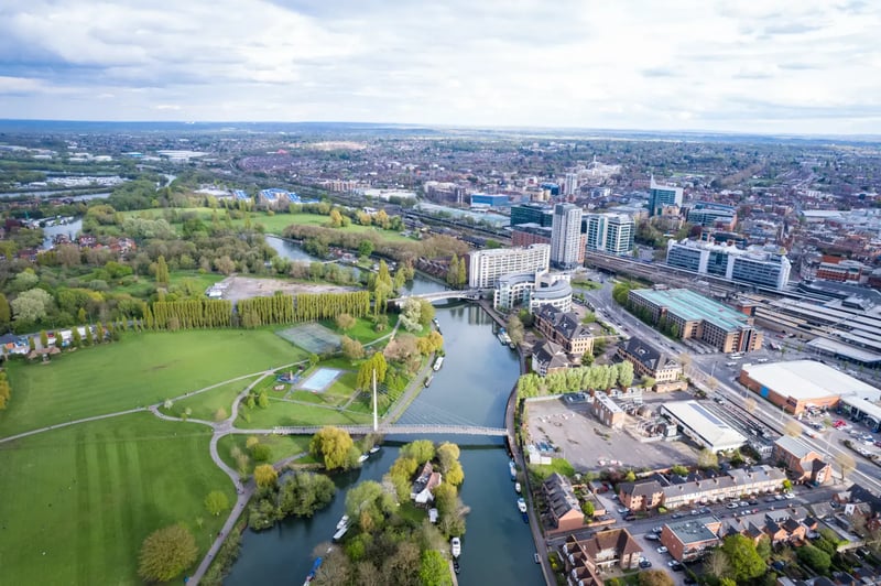 Aerial view of city with river and green space