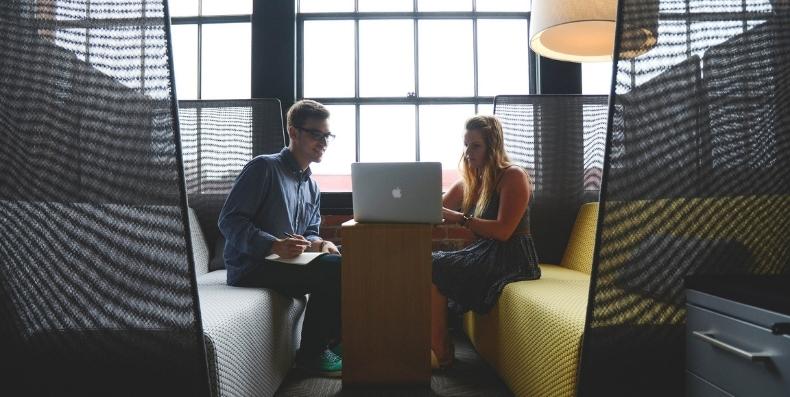 co-workers discussing product-led growth methodology